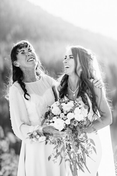 bride and her mom laughing