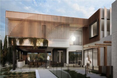 A beautifully designed courtyard and entryway at Nova – Newport, featuring architectural timber screening, lush greenery, and modern concrete finishes.