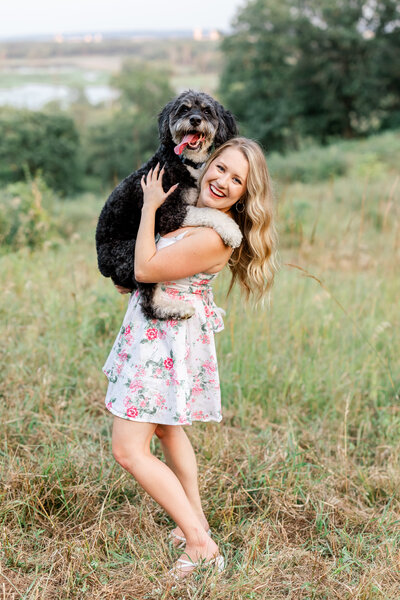 central florida wedding photographer with her dog in field