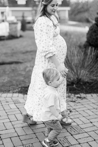 Indianapolis mother poses with her young son during maternity photos by Katelyn Ng Photography.