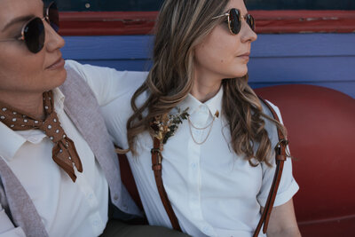 Two women in sunglasses look out into the distance at Nashville's Lipstick Lounge