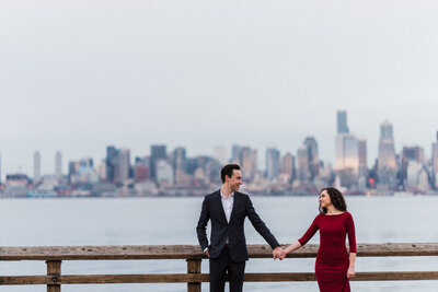 engagement pictures at alki beach with downtown seattle skyline