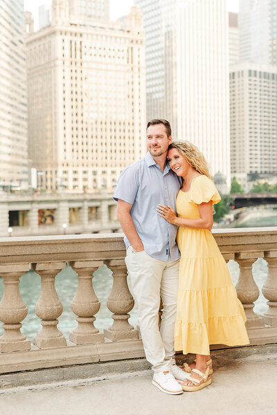 Couple Standing on Michigan Avenue Bridge in Downtown Chicago Illinois