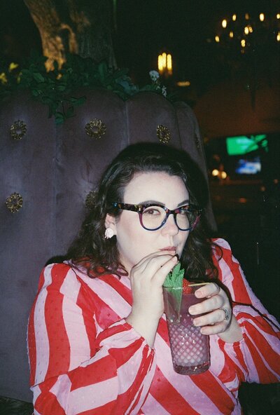 Woman drinking a mocktail at Vanderpump Las Vegas. Photo taken on film camera. Photography by Rhode Tripper Photography