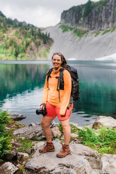 woman and bernese mountain dog smiling at the camera