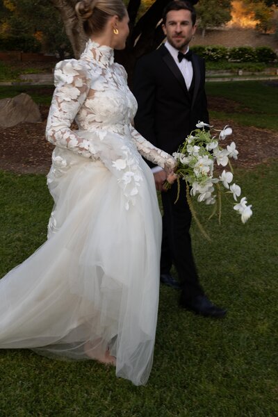Bridal editorial portrait featuring a bride in soft natural makeup and puff sleeve gown, photographed in Los Angeles
