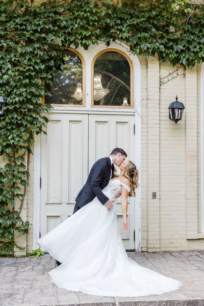 Bride and Groom Portrait resting heads holding bridal bouquet