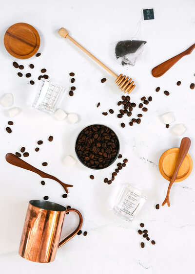 Cream being poured into a cup of coffee