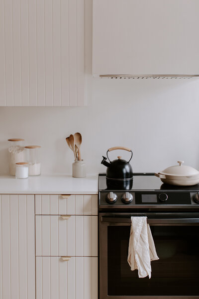 Cozy white kitchen in the serene mountain town of Crowsnest Pass