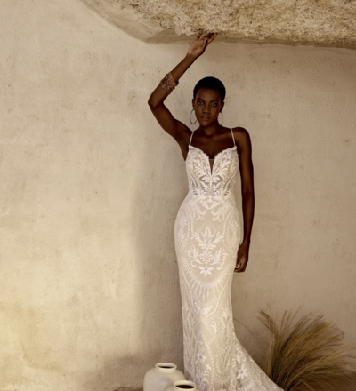 Lillian West stock photo of model wearing fitted, boho romantic, lace wedding dress.