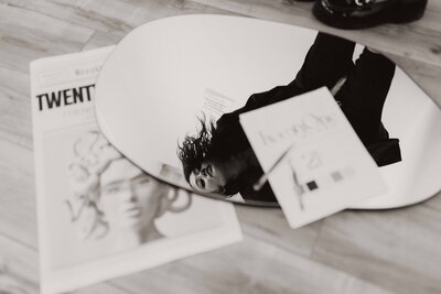 Branding flat lay with heels, coupe glasses, and papers styled in an Alberta studio