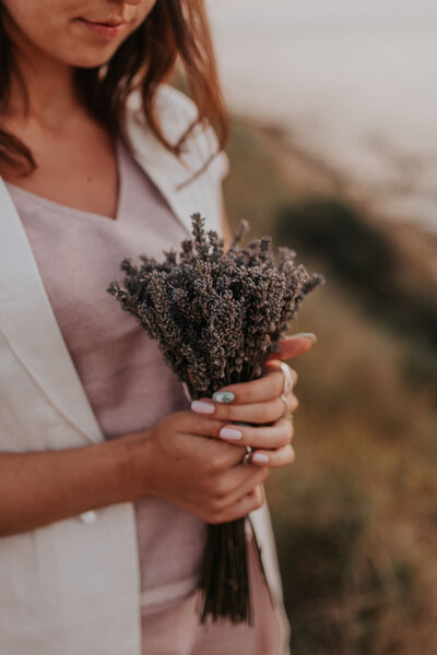 Woman holding a bundle of fresh lavender