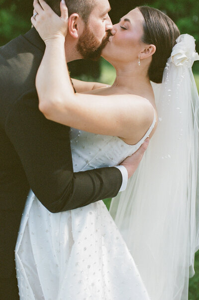 Bride and groom exchange vows in a heartfelt backyard wedding ceremony in Cincinnati