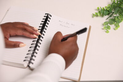 woman writing in journal