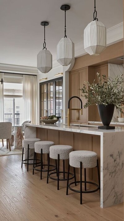 A kitchen in a dream home with white oak and creamy marble