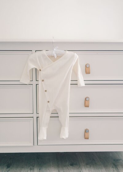White and blue baby jumper.