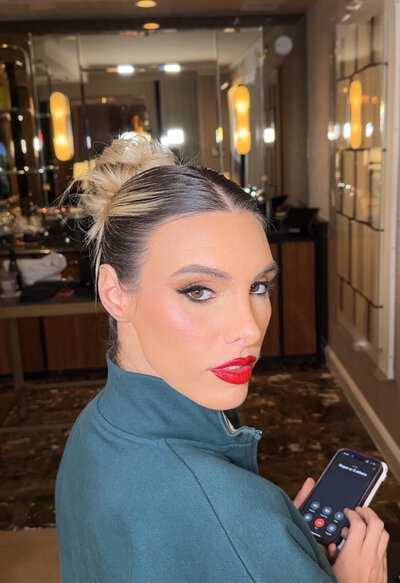 Model Lele with pink shimmer makeup and sleek bun — high-fashion look by MaKall