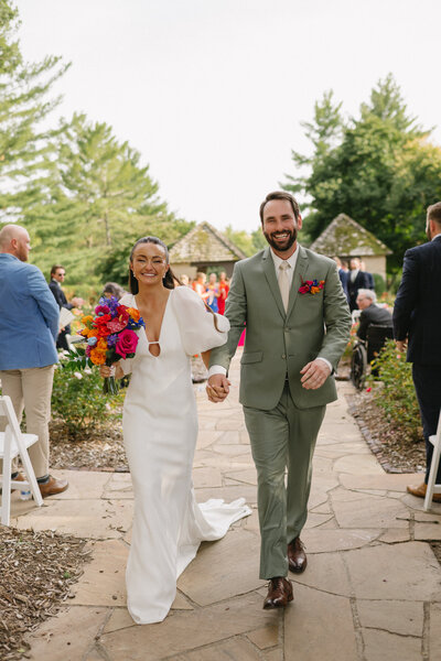 bride and groom at Rose Garden in Des Moines Art center