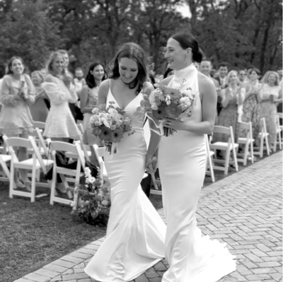LGBTQ couple photographed after their wedding ceremony by a wedding content creator