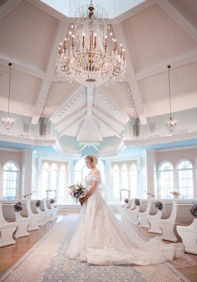 bride holding blush and white bridal bouquet