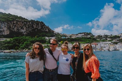 family smiling at the camera