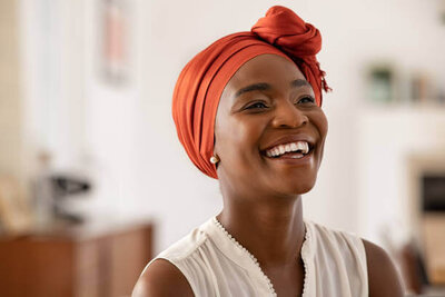 older woman smiling with earphones