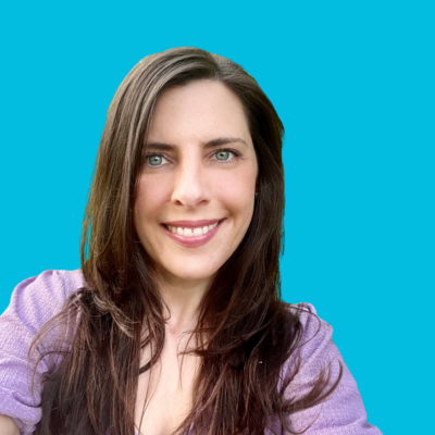Woman Director of Programs at Move Forward with dark hair in purple shirt with blue background
