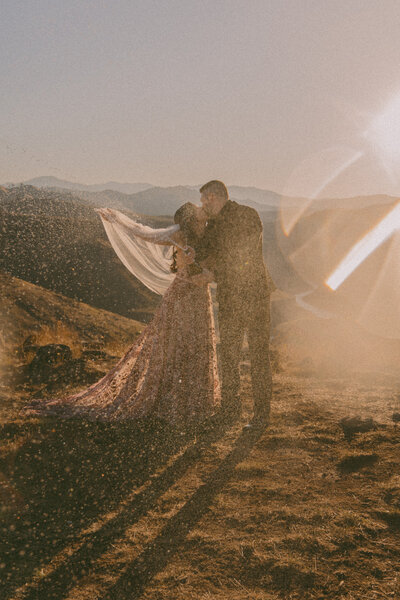 Couple embracing at sunset Boise Idaho engagement photographer