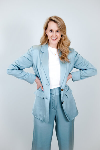 Valerie Greene in blue suit with white top