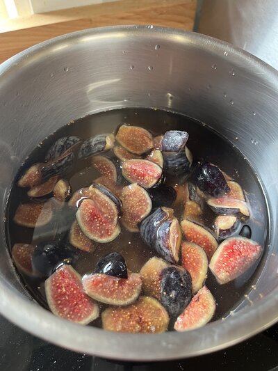Fresh fig and vanilla bean syrup being crafted at Grain Artisan Bakery, made in small batches for seasonal lattes and pastries.