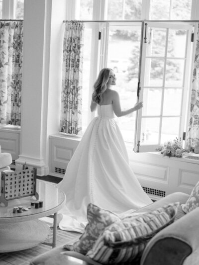 Bride and groom at historic estate entrance – Luxury Wedding Photography Seattle