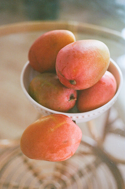 mangos in a white bowl