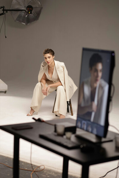 Brand photoshoot of a professional business woman in a beige pant suit.