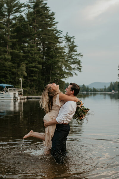 bride and groom in a lake