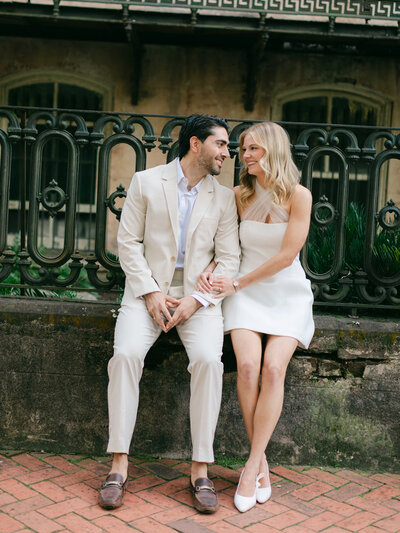Savannah Georgia Engagement Session Couple Sitting at Monterey Square
