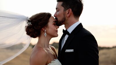 bride and groom holding eachother