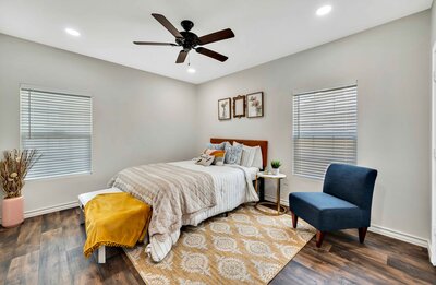 Bedroom with Queen bed in this three-bedroom, two-bathroom vacation rental house just 5 minutes from The Silos in downtown Waco, TX.