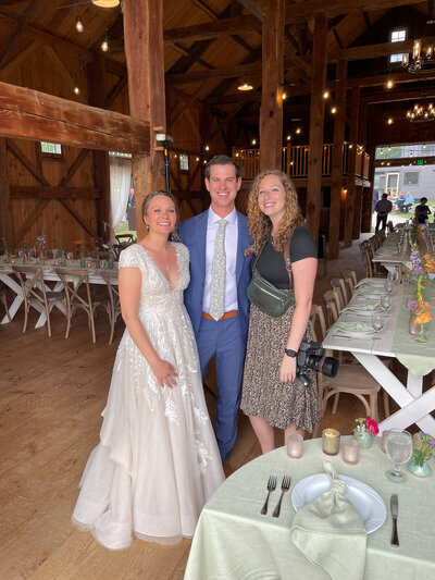 photographer with bride and groom