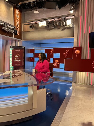 woman sitting in chair at nbc news station