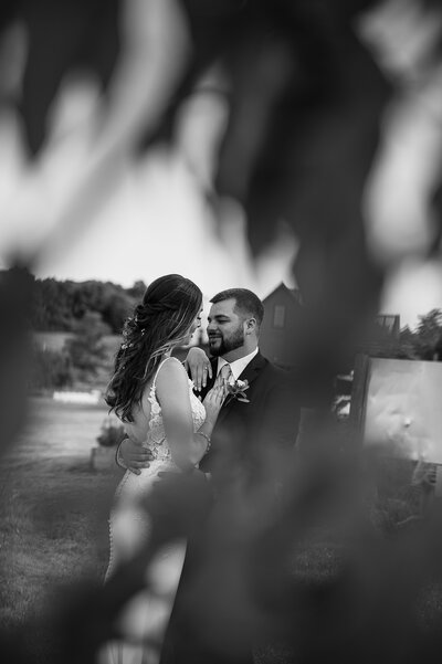 bride and groom about to kiss