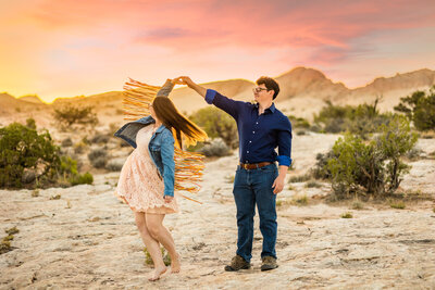 Couple dancing in the dessert at sunset, photographed by Baltimore photographer Kimberly Dean