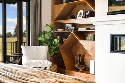 a rustic kitchen with wood beams and custom pendants
