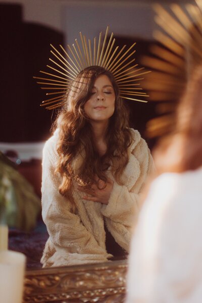Luna Skye hand on heart wearing sun crown