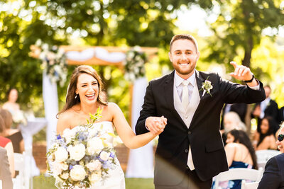 Bride and groom joyfully holding hands, Baltimore Wedding Photography