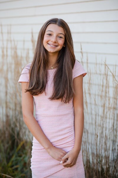Bat Mitzvah girl Ella headshot outside of her synagogue, Shir Tikva.