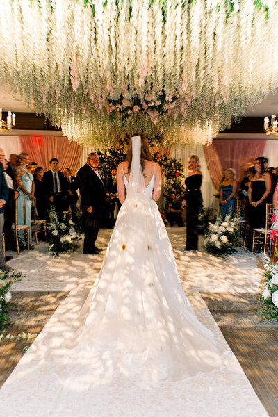 image of bride walking down the aisle