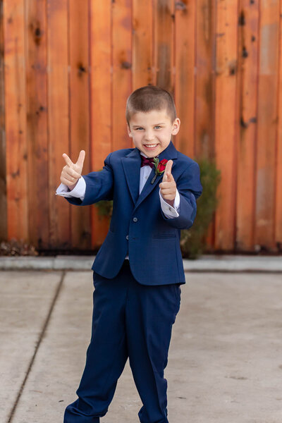 Fun and playful 'Love Gun' moment at a wedding at Piazza Messina, Cottleville, MO, captured by Style & Grace Photography