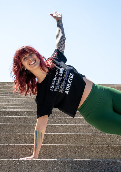 a woman side planking on steps for online strength coaching