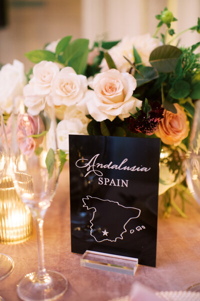 Black acrylic table number with white etched table name and Andalusia Spain map icon
