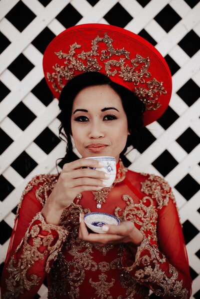 Bride in traditional Vietnamese red wedding dress